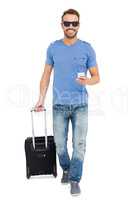 Young man with trolley bag and mobile phone