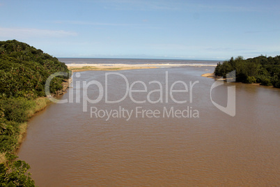 River Mouth into Sea on Sunny Day