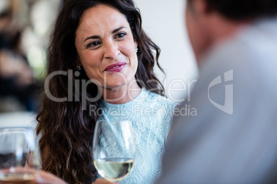 Couple holding wine glass and interacting