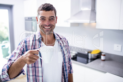 Portrait of happy man having coffee