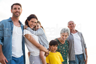 Happy family posing at the beach