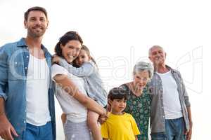 Happy family posing at the beach