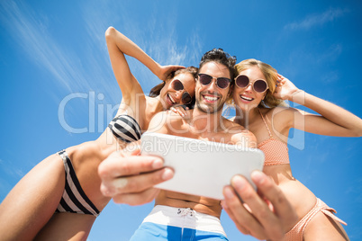 Happy friends having fun on beach