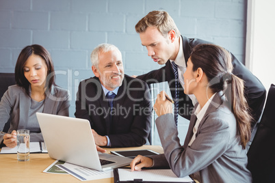 Businesspeople interacting in conference room