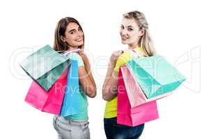 Portrait of friends holding shopping bags