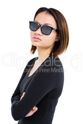 Woman posing and wearing sunglasses