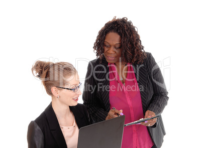 Closeup of two businesswoman working.