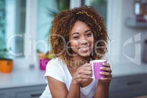Portrait of confident woman having coffee