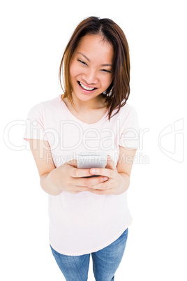 Young woman text messaging on mobile phone