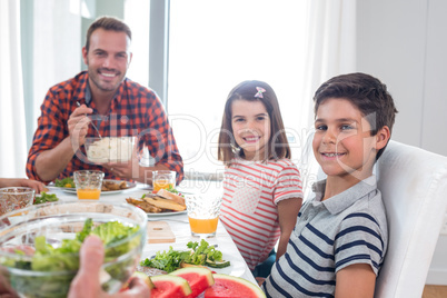 Happy family having breakfast