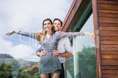 Happy couple posing in balcony