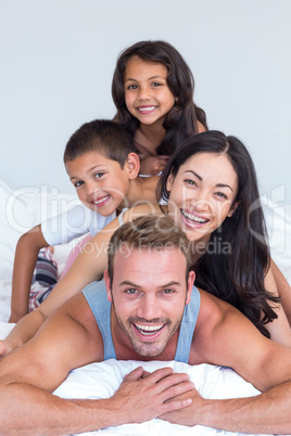 Happy family in their bedroom