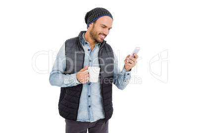 Man using mobile his phone while drinking coffee