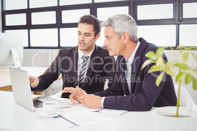 Business people working on laptop