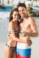 Couple posing and holding smartphone