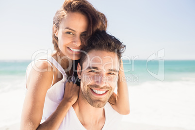 Boyfriend giving piggy back to girlfriend