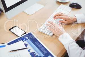 Businesswoman using computer at desk