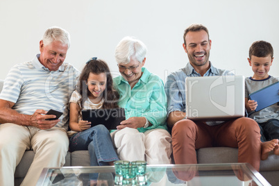 Happy family sitting on sofa