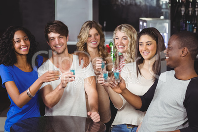 Group of friends having shots