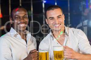 Handsome men drinking together