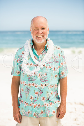 Senior man standing at the beach