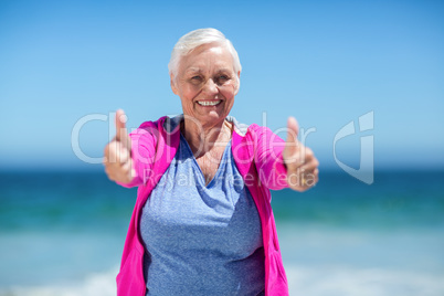 Mature woman showing thumbs up