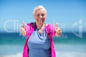 Mature woman showing thumbs up