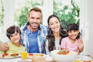 Portrait of cheerful parents and children