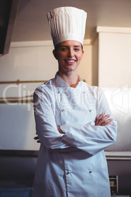 Chef smiling and posing with crossed arms