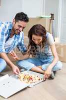 Happy couple having pizza