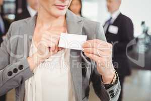 Close-up of Businesswoman showing her badge