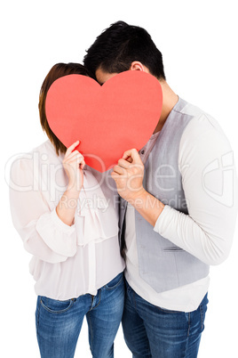 Young couple holding a heart shape