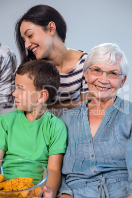 Happy family sitting on sofa