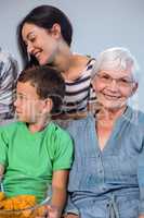 Happy family sitting on sofa