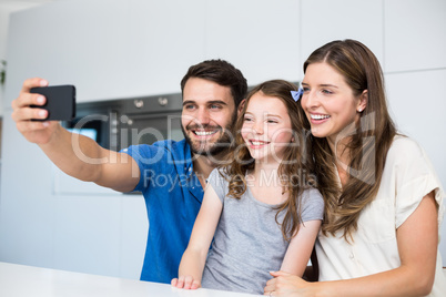 Happy family clicking selfie