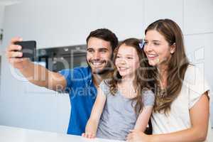 Happy family clicking selfie