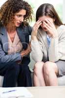 Close-up of psychologist counselling depressed woman