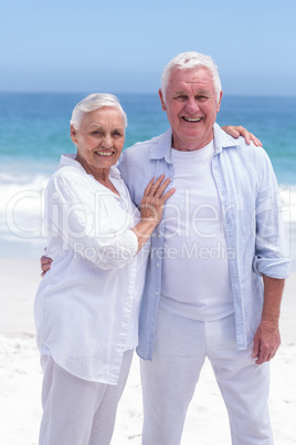 Senior couple smiling and looking the camera