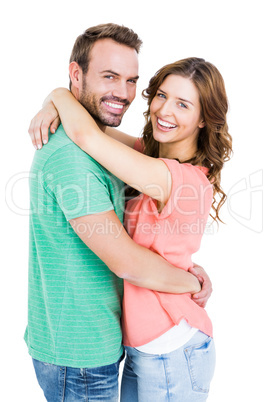 Happy young couple cuddling each other