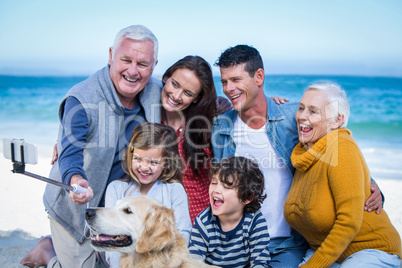 Happy family with their dog taking a selfie