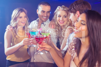 Happy friends with cocktails Happy friends with cocktails