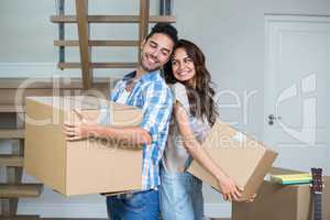 Happy couple with boxes