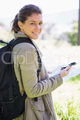 Woman with map and compass