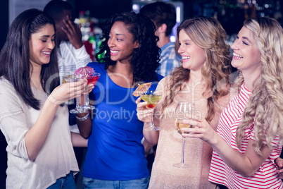 Friends drinking cocktails together