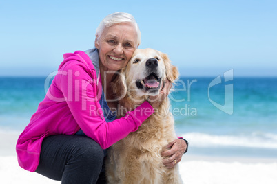 Cute mature woman petting her dog