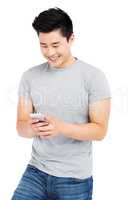 Young man text messaging on mobile phone