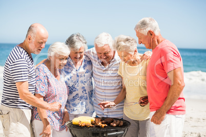 Senior having a barbecue on the beach