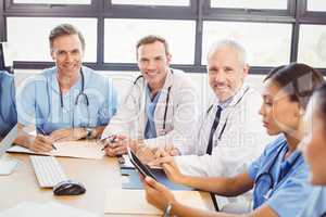 Portrait of doctors smiling in conference room