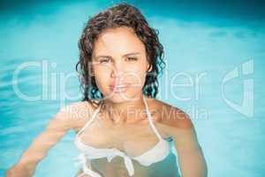 Portrait of beautiful woman in swimming pool