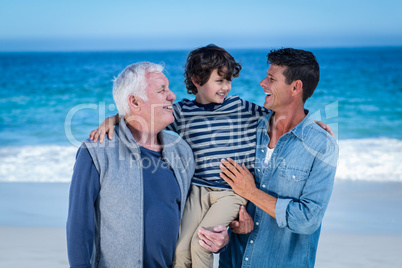 Male family members posing at the beach